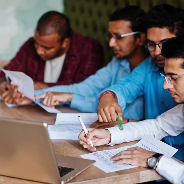 group-four-south-asian-men-s-posed-business-meeting-cafe-indians-together-sign-important-documents-contract-study-work