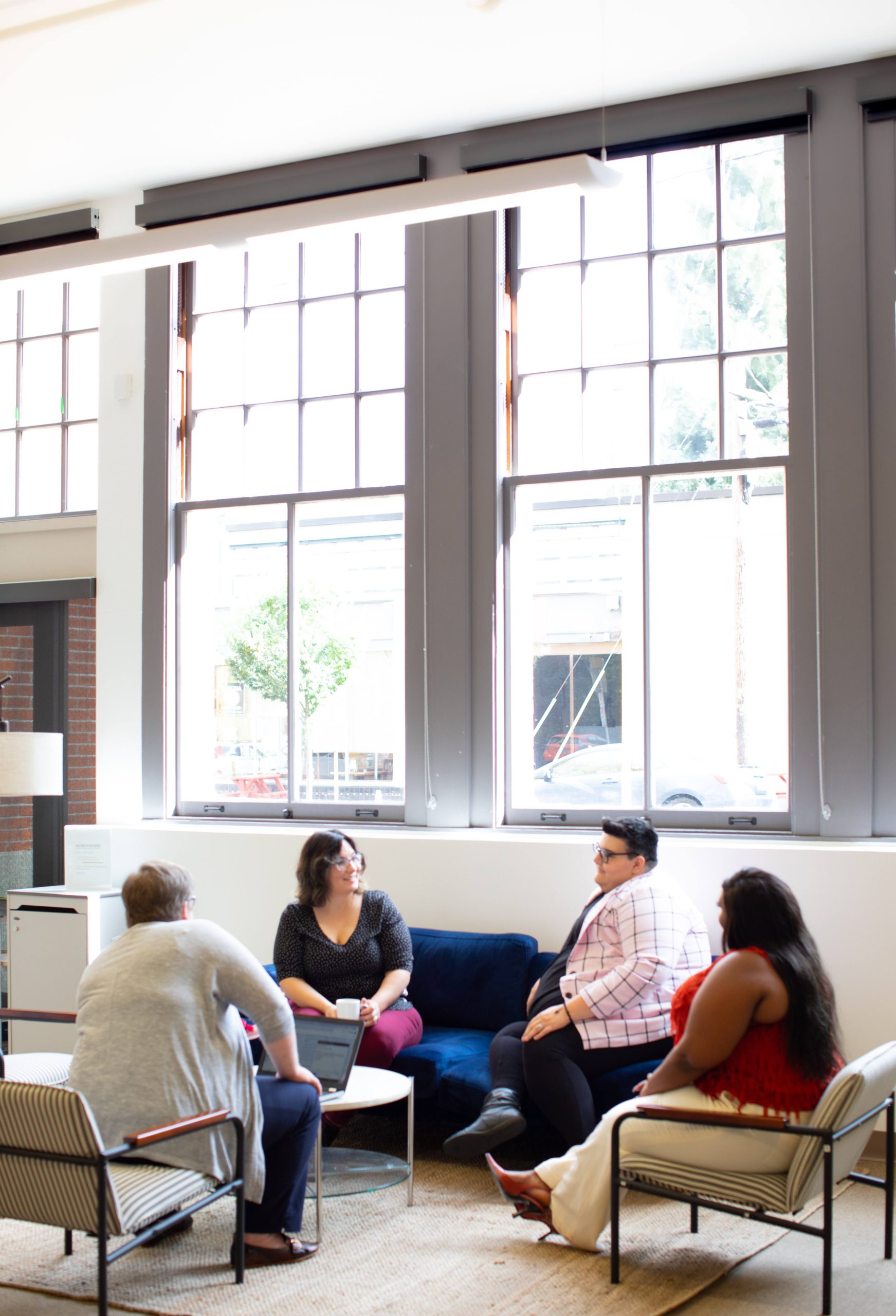 A group of people sitting around in a room.