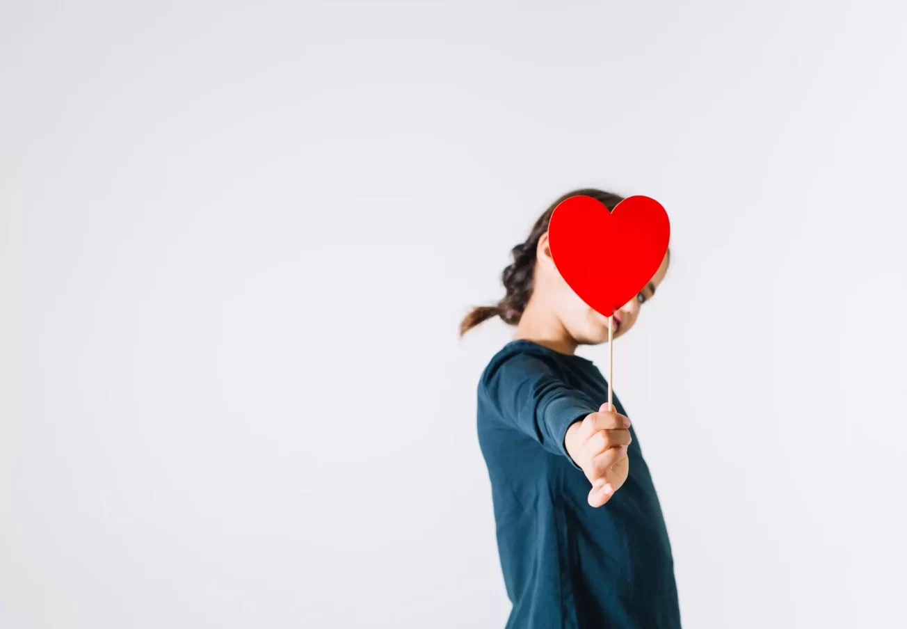 girl-giving-heart